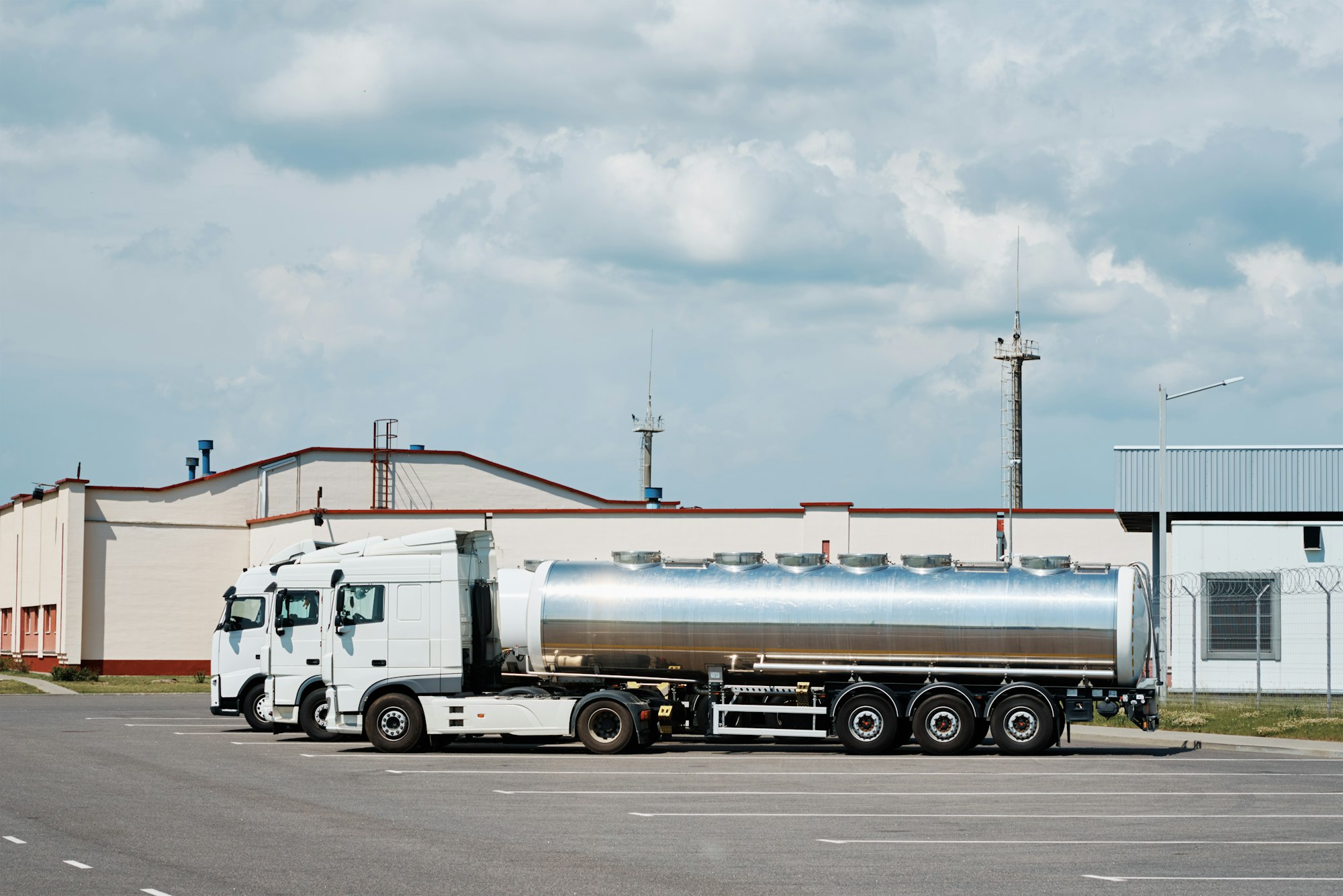 Trucks with tank trailer on parking lot