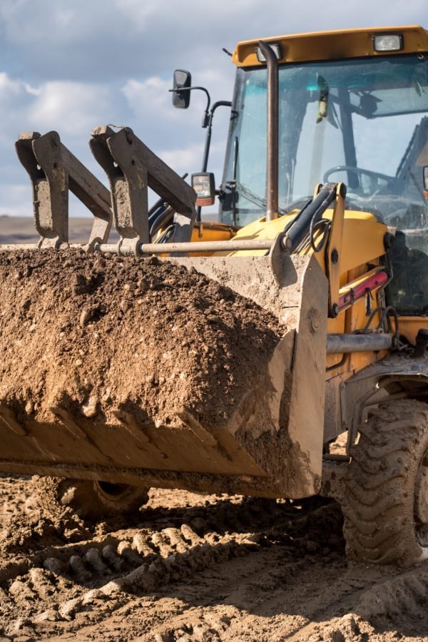 Close up details of industrial backhoe loader, details of machinery on construction site